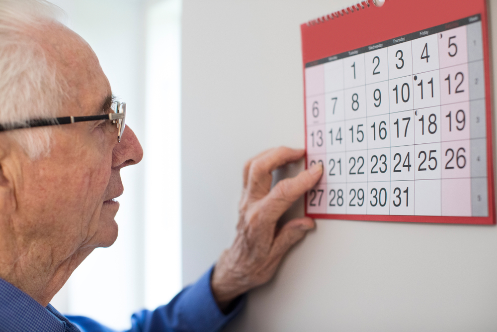 Communication in dementia care: Man looking at his calendar