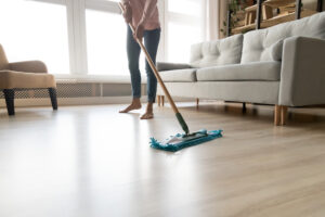 Woman mopping floors at home