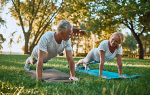 Senior couple doing yoga exercises to reduce stress
